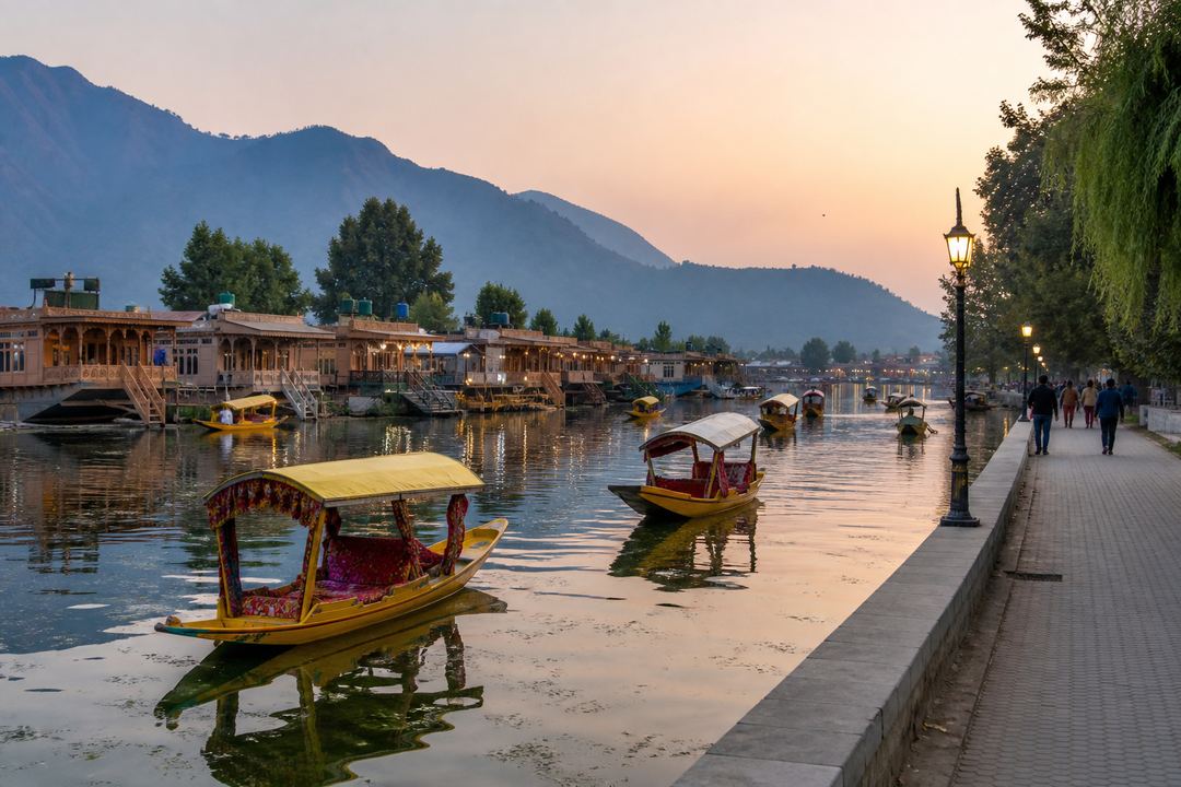 Shikaras on Dal Lake near Boulevard Road at dusk with houseboats, reflections on the water and hills in the background.